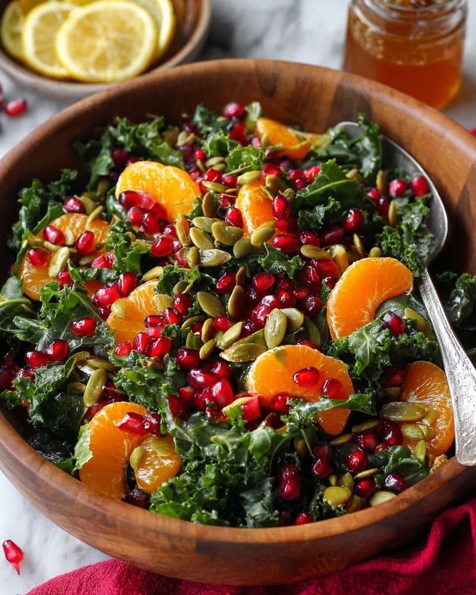A clear glass bowl filled with a fresh salad showing three layers: the bottom layer is dark green curly kale with a rough texture, the middle layer consists of bright orange tangerine segments placed evenly across the kale, and the top layer is made up of shiny red pomegranate seeds scattered throughout. A wooden spoon is partially immersed in the salad on the right side. The bowl is placed on a white marbled textured surface. Photo taken with an iphone --ar 4:5 --v 7