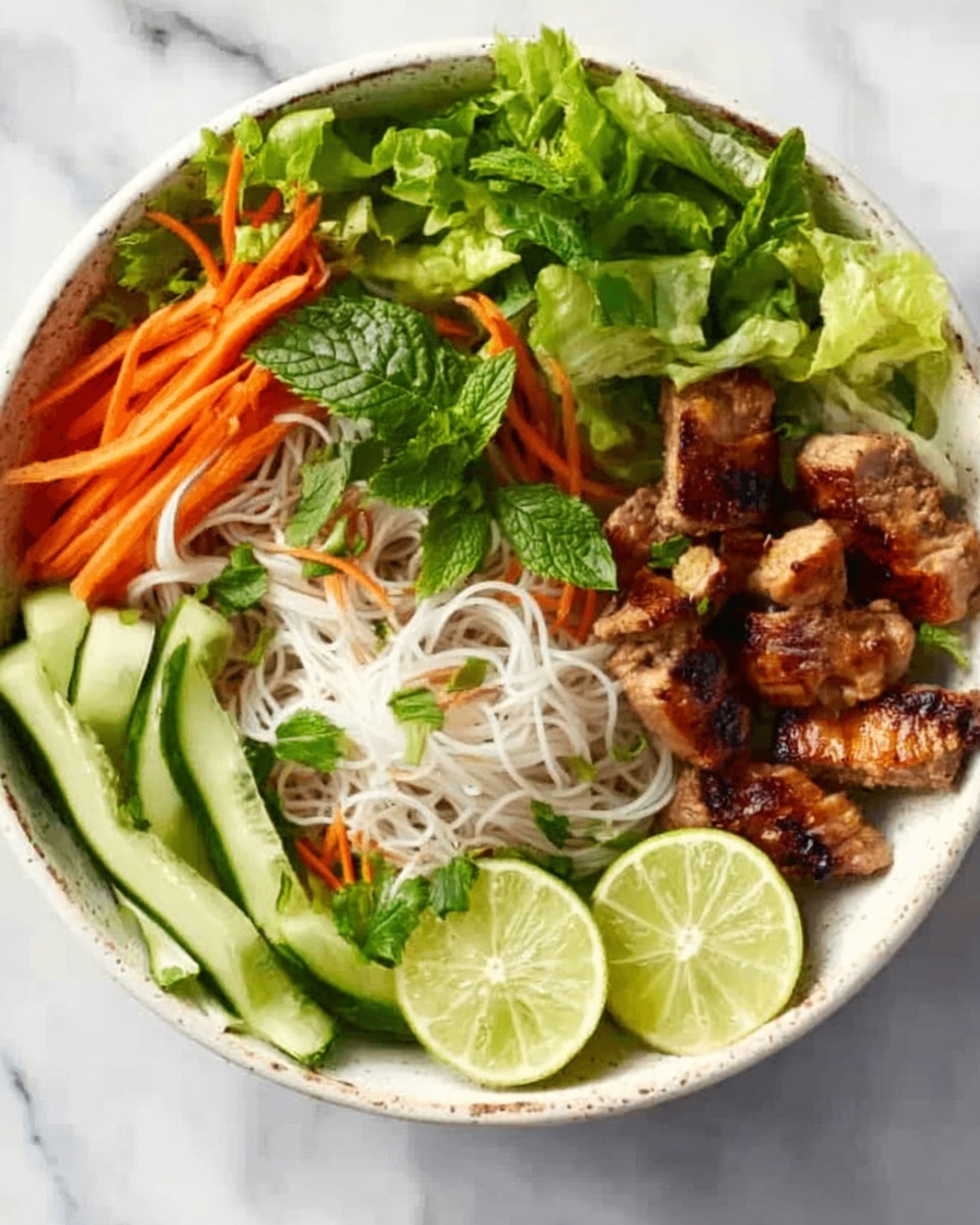 A white bowl filled with a colorful dish layered with fresh vegetables and cooked meat. At the bottom, there are thin, white rice noodles forming the base. On one side, there are bright green lettuce leaves and fresh herbs, while thin orange carrot sticks and pale green cucumber sticks are arranged neatly next to them. Grilled pieces of golden-brown meat are placed near the center right, adding a cooked texture and warm color. Two lime wedges sit at the edge of the bowl, adding a fresh citrus touch. The background shows a white marbled surface. Photo taken with an iphone --ar 4:5 --v 7