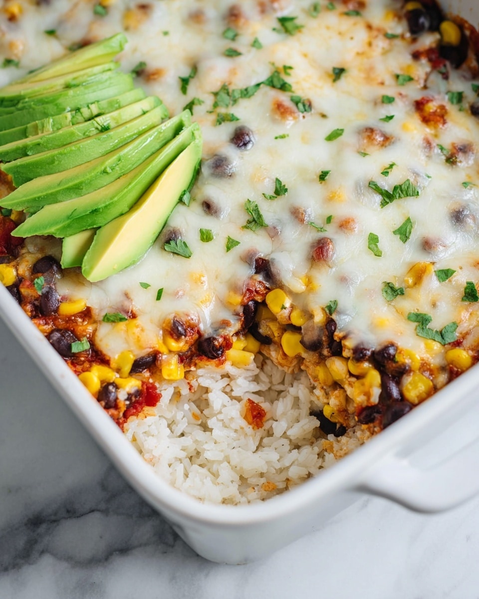 A close-up view of a white rectangular baking dish filled with a three-layer casserole; the bottom layer is white rice, the middle layer consists of bright yellow corn and black beans mixed with some red seasoning, and the top layer is melted white cheese with slightly browned spots. Small green herb pieces are sprinkled over the cheese. In the corner of the dish, there are several thin slices of green avocado fanned out neatly. The dish is set on a white marbled surface. Photo taken with an iphone --ar 4:5 --v 7