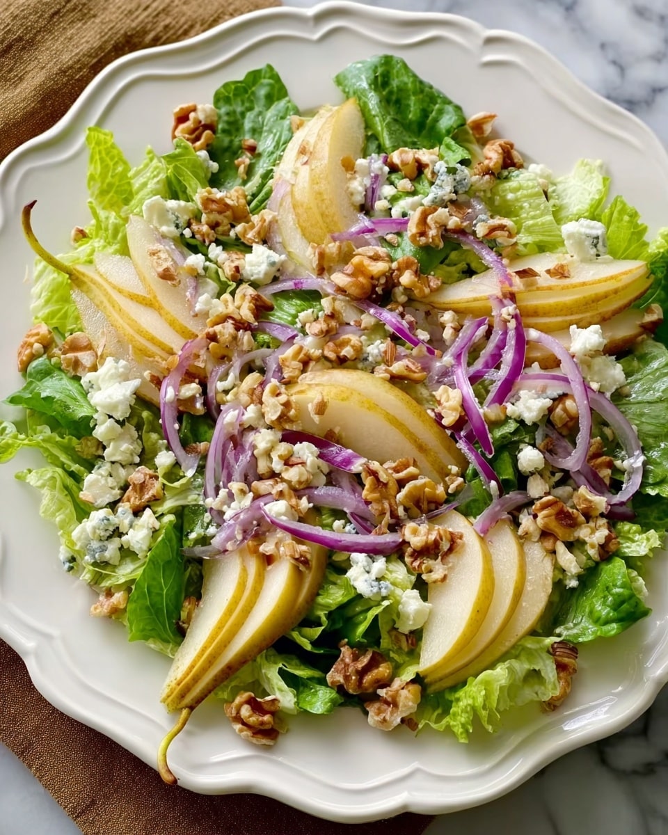 A fresh salad presented on a white plate with a scalloped edge, layered with crisp green lettuce as the base. On top of the lettuce are slices of pale yellow pear arranged in a circular pattern, with thin strips of purple-red onion scattered evenly. Small chunks of white cheese and light brown chopped walnuts are sprinkled generously over the entire salad, adding texture and color contrast. The whole dish rests on a white marbled surface, enhancing the fresh and natural look of the salad. photo taken with an iphone --ar 4:5 --v 7