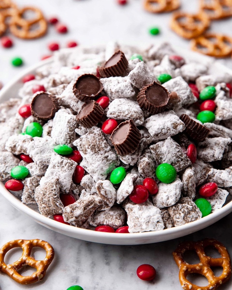 A white plate is filled with a snack mix that has three main layers. The bottom layer consists of chunks covered in white powdered sugar, looking rough and uneven with a dusty texture. The middle layer has small red and green candy-coated chocolates scattered evenly, showing a smooth and shiny surface. The top layer contains small chocolate cups, some whole and others cut in half, placed randomly on top, with a rich brown color and a smooth texture. The plate is set on a white marbled texture surface, and there are more candies and pretzels visible around the edge. Photo taken with an iphone --ar 4:5 --v 7