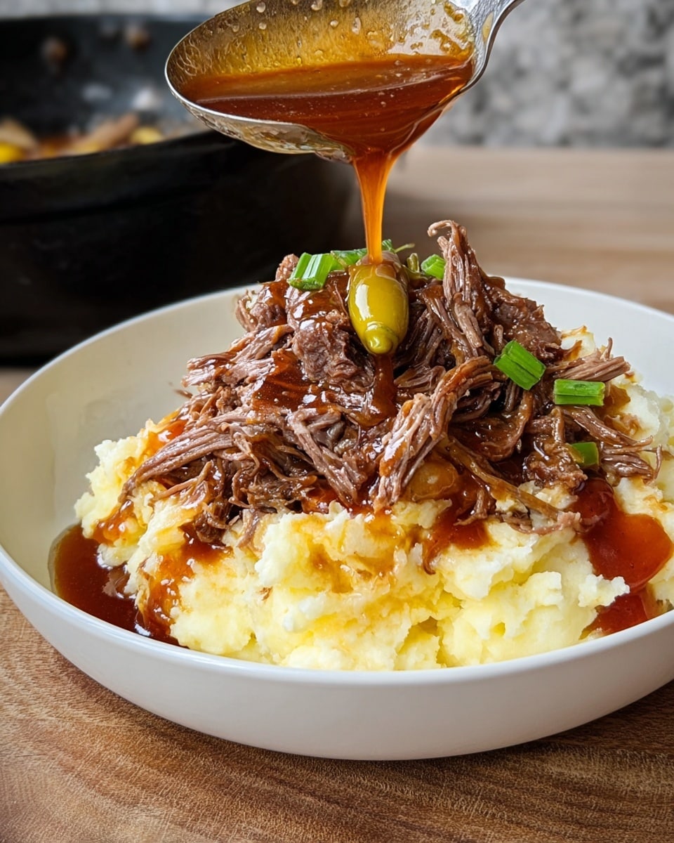 The dish shows a white bowl filled with two main layers: at the bottom, a creamy, smooth mashed potato layer in off-white color, topped with a thick layer of shredded, tender beef with a brown color and fibrous texture. On top of the beef, a yellowish-green pepper is placed. A woman's hand is pouring a glossy, amber-brown sauce from a metal ladle over the beef, which glistens as it drips down. The bowl is placed on a wooden surface with a white marbled texture background. photo taken with an iphone --ar 4:5 --v 7
